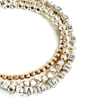 All is Well and Everything is OkSterling silver gift affirmation and mantra, shown with gold stacking bracelet