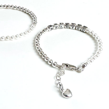 Beaded bracelet with sterling silver and pearls spelling out BELOVED, with heart charm