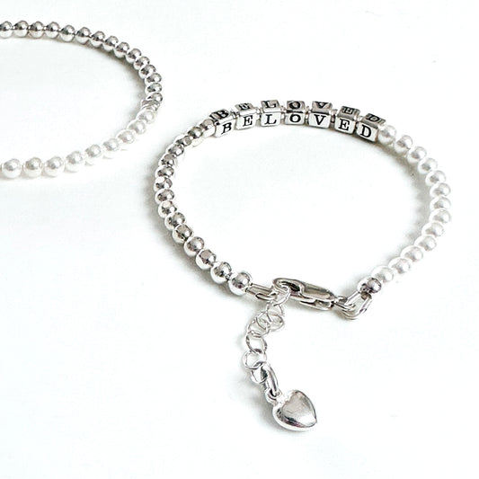 Beaded bracelet with sterling silver and pearls spelling out BELOVED, with heart charm