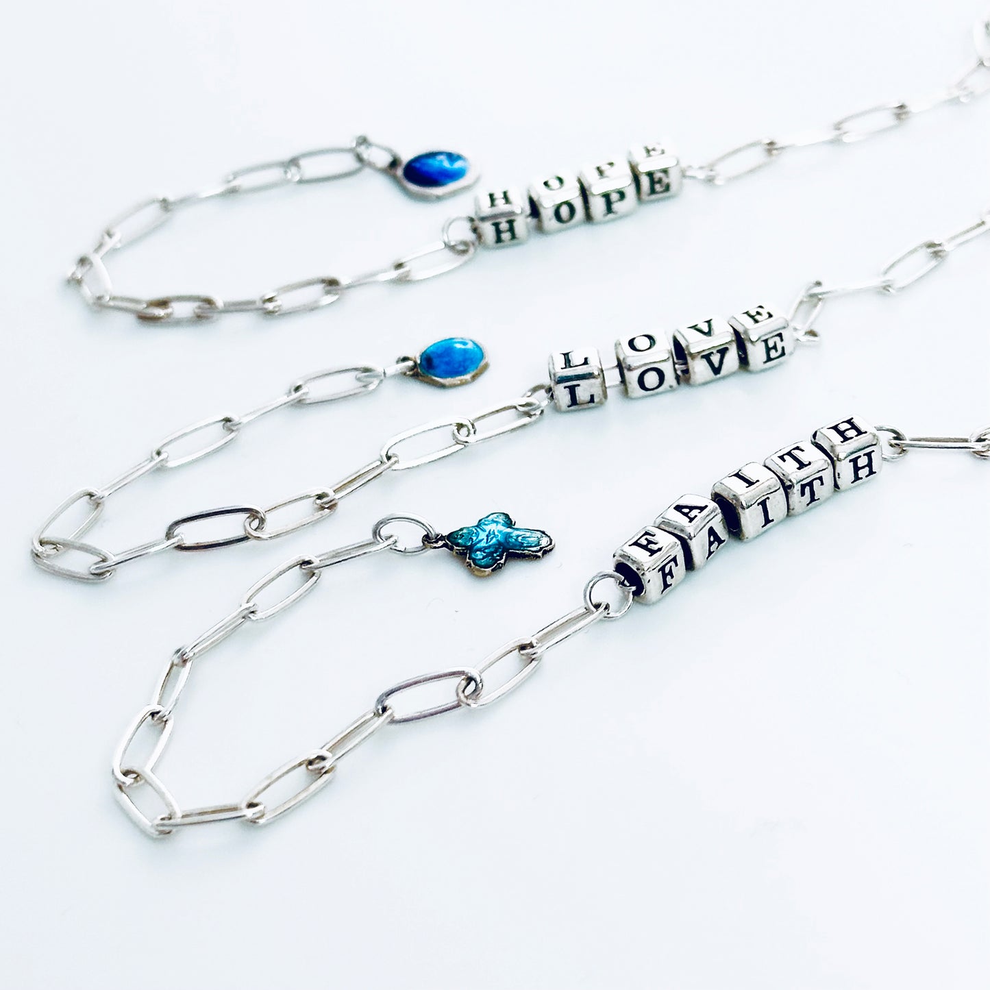 Delicate sterling silver Faith Hope Love  Christina  bracelets with vintage blue charms
