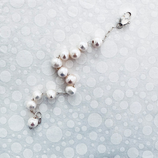 Sterling silver bracelet with floating pearls and sterling silver  heart clasp