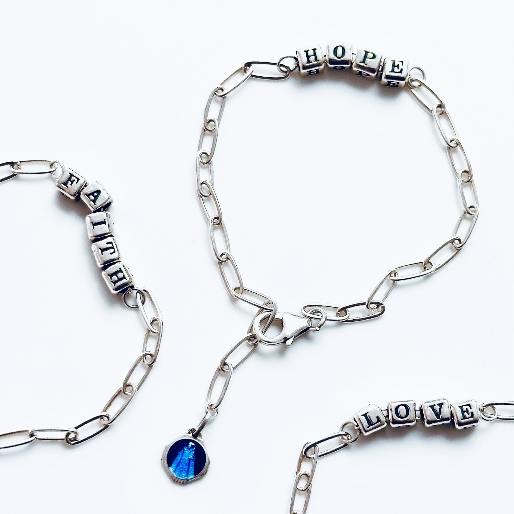 Hope Bracelet in sterling silver letter beads, with a vintage Catholic religious medal in blue enamel