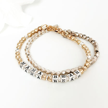 Mama Bear Sterling Silver and 14K Gold beaded bracelet with star charm shown with sterling silver beaded stacking bracelet