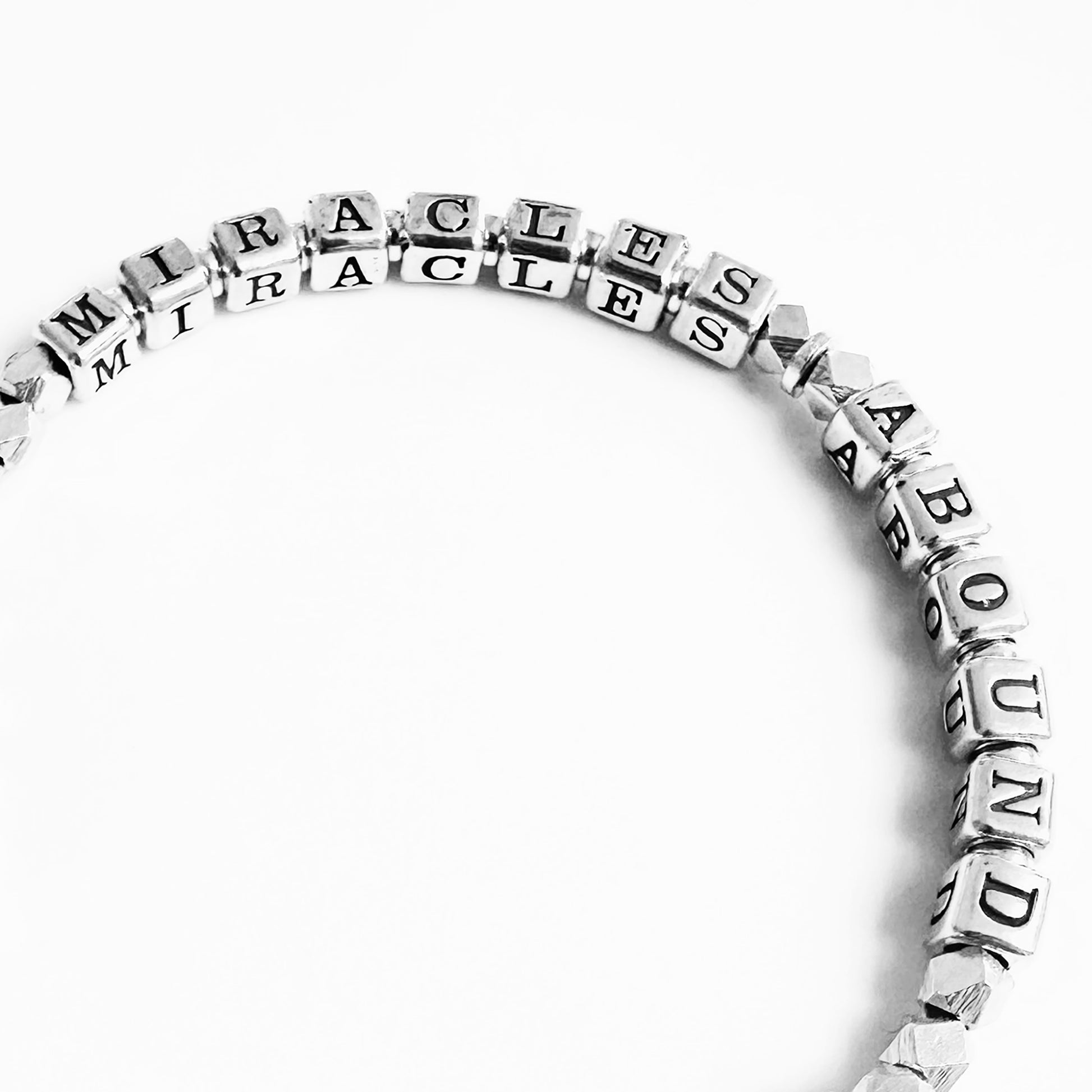 Sterling Silver Miracles and Hope Gift Bracelet spells our MIRACLES ABOUND