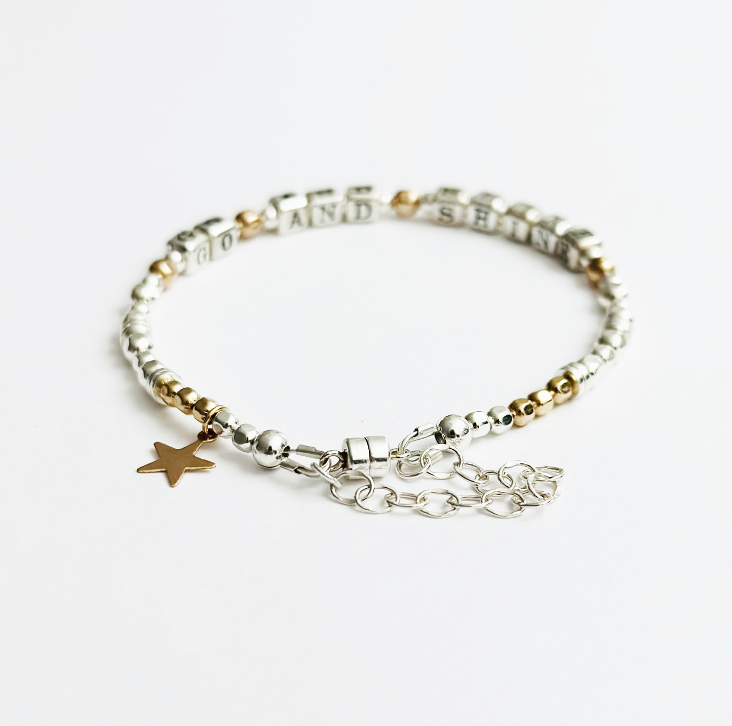 Graduation Gift Bracelet spelling out GO AND SHINE in sterling silver and gold beads, with 14k gold star charm